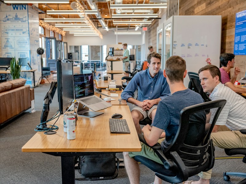 Team discussing a shared plan around a table